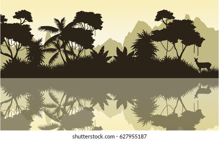 Silhouette of jungle with mountain background scenery