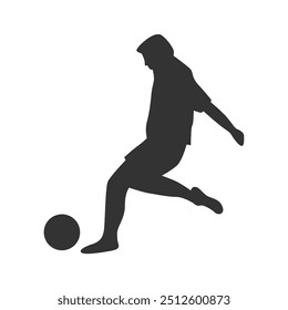 Silhouette Kicking Ball at Sunset on Field