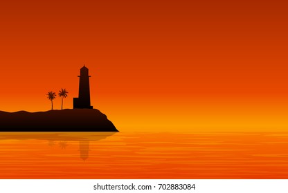 Silhouette Light House on shore at Sunset with orange color of evening sky background