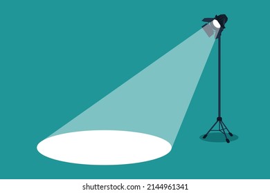 Silhouette of light lamp projector on a tripod with scattered rays. Projecting a beam of spotlight is glowing on down. Cinema background. Template for festive banner, flyer, poster with place for text