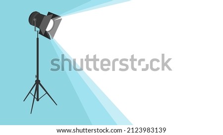 Silhouette of light projector on a tripod with scattered rays. Cinema background. Spotlight is glowing on wall. Template for banner, brochure, flyer, poster with place for text. Movie time concept.