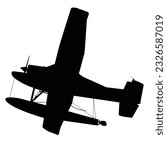 A silhouette of a light seaplane