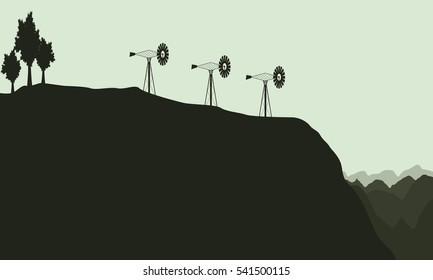 Silhouette of lined windmill landscape