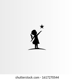 silhouette of a little girl with star - vector illustration