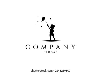 Silhouette logo of little boy playing kite in flat design style