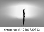Silhouette of a lone man standing with reflection on water in abstract light background conveys themes of solitude, reflection, sadness, introspection, or emotional isolation