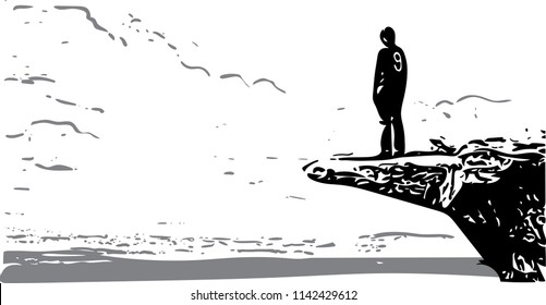 Silhouette of lonely young man on the cliff.