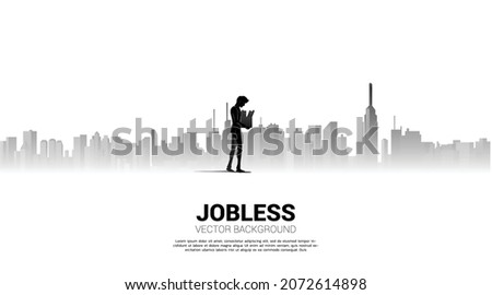 silhouette of losing job man walking with big city background.  Concept for depression of unemployment people.