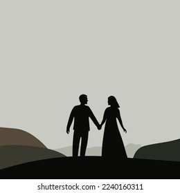 Silhouette of a lovely couple standing on the mountains and holding hands