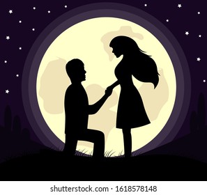 silhouette of lovers in the moon