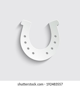 silhouette lucky horseshoe with shadow on a grey background