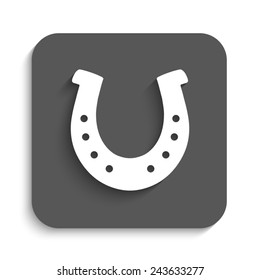 silhouette lucky horseshoe - vector icon with shadow on a grey button