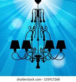 silhouette of luxury chandeliers with rays on a blue waved background 