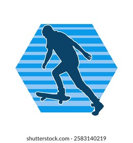 Silhouette of a male in action pose on skateboard. Silhouette of an urban boy on skateboard.