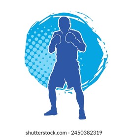 Silhouette of male boxing athlete in action pose. Silhouette of a muscular man wearing boxing gloves for boxing sport.