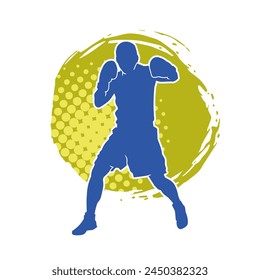 Silhouette of male boxing athlete in action pose. Silhouette of a muscular man wearing boxing gloves for boxing sport.