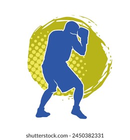 Silhouette of male boxing athlete in action pose. Silhouette of a muscular man wearing boxing gloves for boxing sport.