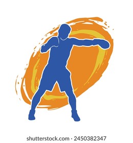 Silhouette of male boxing athlete in action pose. Silhouette of a muscular man wearing boxing gloves for boxing sport.