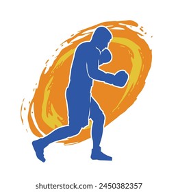 Silhouette of male boxing athlete in action pose. Silhouette of a muscular man wearing boxing gloves for boxing sport.