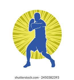 Silhouette of male boxing athlete in action pose. Silhouette of a muscular man wearing boxing gloves for boxing sport.