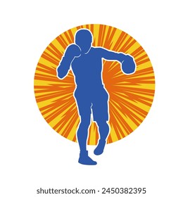 Silhouette of male boxing athlete in action pose. Silhouette of a muscular man wearing boxing gloves for boxing sport.