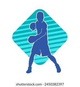 Silhouette of male boxing athlete in action pose. Silhouette of a muscular man wearing boxing gloves for boxing sport.