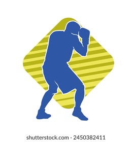 Silhouette of male boxing athlete in action pose. Silhouette of a muscular man wearing boxing gloves for boxing sport.