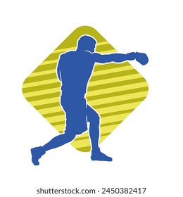 Silhouette of male boxing athlete in action pose. Silhouette of a muscular man wearing boxing gloves for boxing sport.