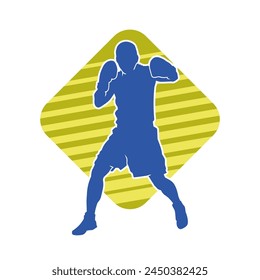 Silhouette of male boxing athlete in action pose. Silhouette of a muscular man wearing boxing gloves for boxing sport.