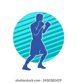 Silhouette of male boxing athlete in action pose. Silhouette of a muscular man wearing boxing gloves for boxing sport.