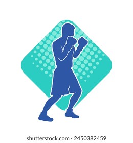 Silhouette of male boxing athlete in action pose. Silhouette of a muscular man wearing boxing gloves for boxing sport.