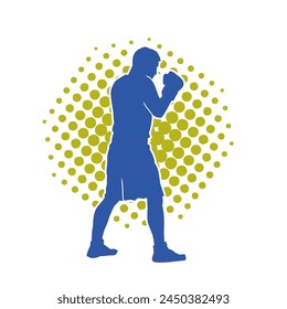 Silhouette of male boxing athlete in action pose. Silhouette of a muscular man wearing boxing gloves for boxing sport.