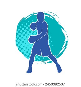 Silhouette of male boxing athlete in action pose. Silhouette of a muscular man wearing boxing gloves for boxing sport.