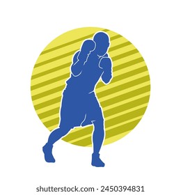 Silhouette of male boxing athlete in action pose. Silhouette of a muscular man wearing boxing gloves for boxing sport.