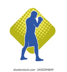 Silhouette of male boxing athlete in action pose. Silhouette of a muscular man wearing boxing gloves for boxing sport.