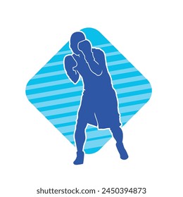 Silhouette of male boxing athlete in action pose. Silhouette of a muscular man wearing boxing gloves for boxing sport.