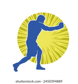 Silhouette of male boxing athlete in action pose. Silhouette of a muscular man wearing boxing gloves for boxing sport.