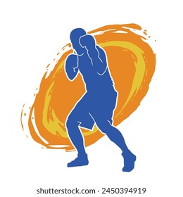 Silhouette of male boxing athlete in action pose. Silhouette of a muscular man wearing boxing gloves for boxing sport.