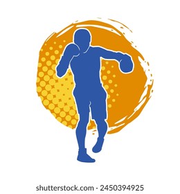 Silhouette of male boxing athlete in action pose. Silhouette of a muscular man wearing boxing gloves for boxing sport.