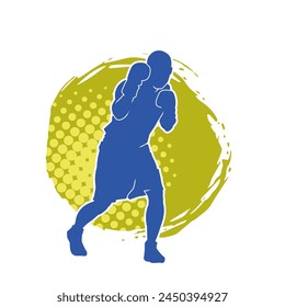 Silhouette of male boxing athlete in action pose. Silhouette of a muscular man wearing boxing gloves for boxing sport.