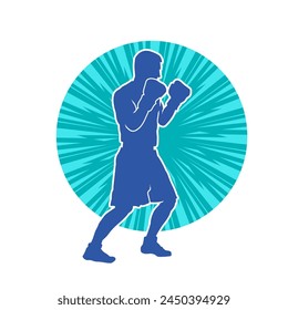 Silhouette of male boxing athlete in action pose. Silhouette of a muscular man wearing boxing gloves for boxing sport.