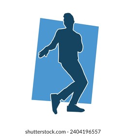 Silhouette of a male dancer in action pose. Silhouette of a slim man in dancing pose.