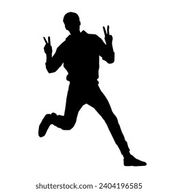 Silhouette of a male dancer in action pose. Silhouette of a slim man in dancing pose.