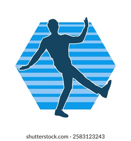 Silhouette of a male dancer in action pose. Silhouette of a slim man in dancing pose.