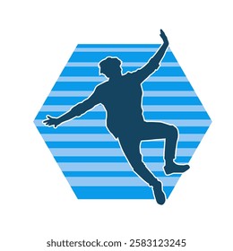 Silhouette of a male dancer in action pose. Silhouette of a slim man in dancing pose.