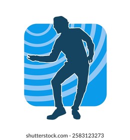 Silhouette of a male dancer in action pose. Silhouette of a slim man in dancing pose.