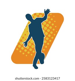 Silhouette of a male dancer in action pose. Silhouette of a slim man in dancing pose.