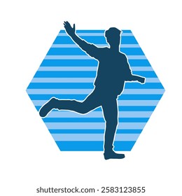 Silhouette of a male dancer in action pose. Silhouette of a slim man in dancing pose.