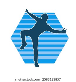 Silhouette of a male dancer in action pose. Silhouette of a slim man in dancing pose.