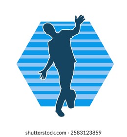 Silhouette of a male dancer in action pose. Silhouette of a slim man in dancing pose.